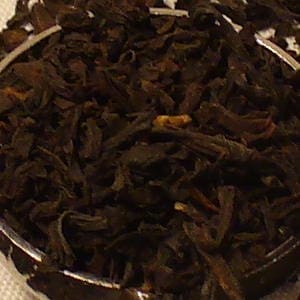Loose black tea leaves in bowl