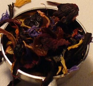 A bowl filled with dried colorful flower petals.