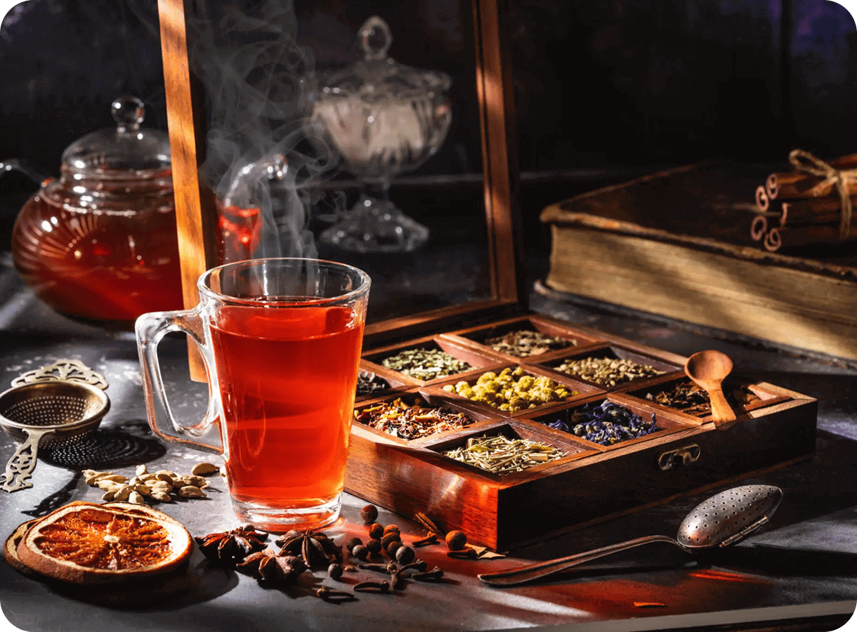 Glass of tea with assorted spices box.