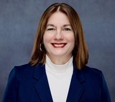 Smiling professional woman in navy blazer