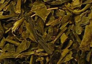 Close-up of dried green tea leaves.